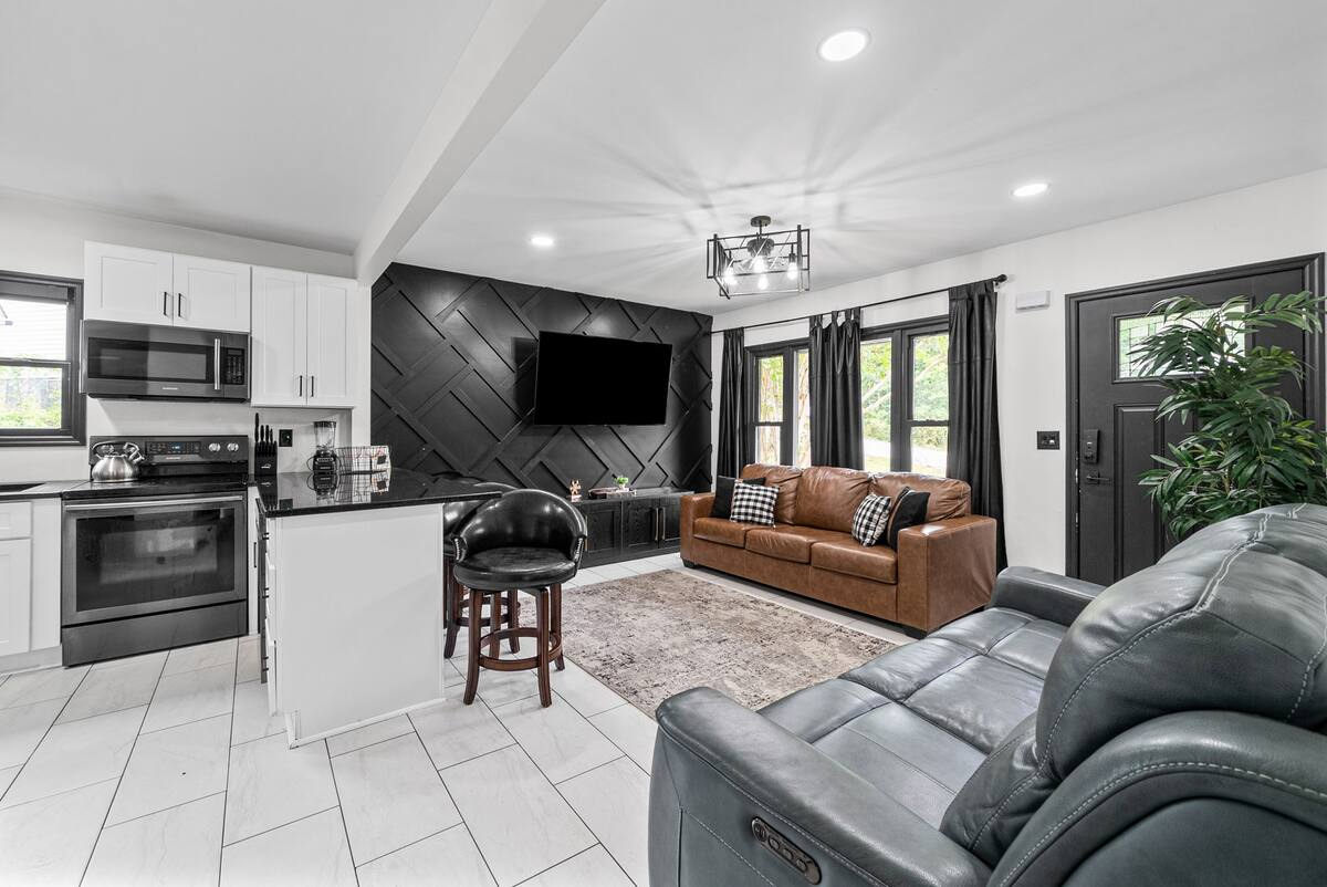 Furnished living room and kitchen in an extended-stay rental