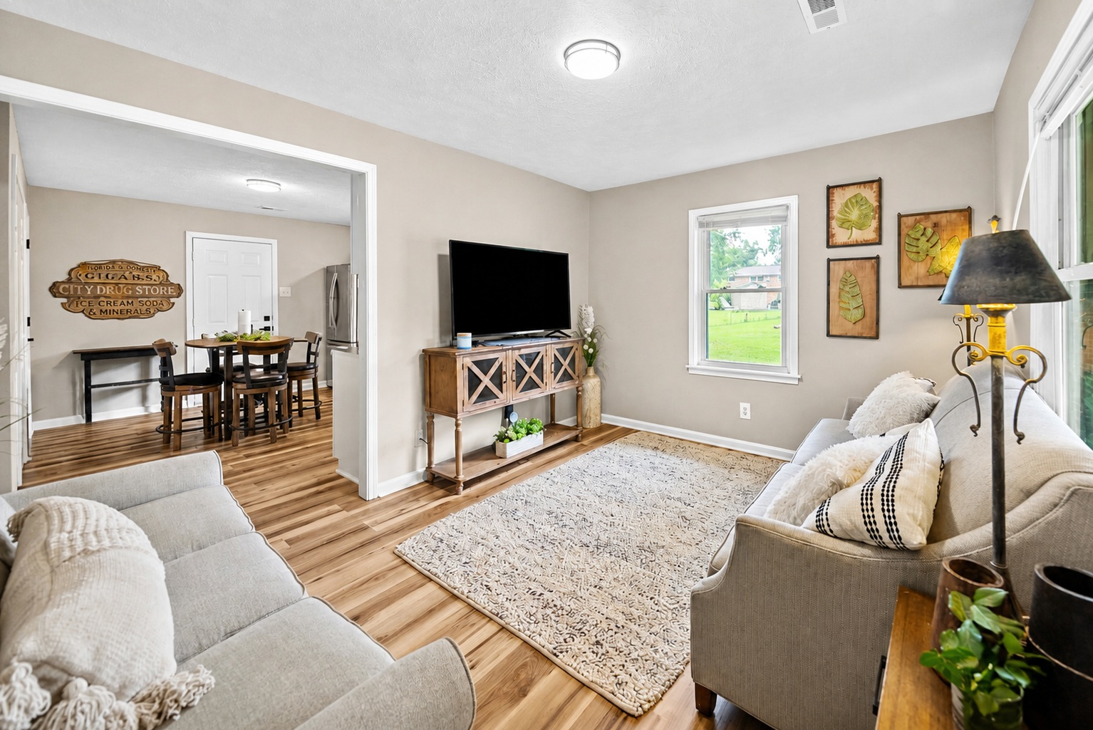 Bright furnished living room with seating
