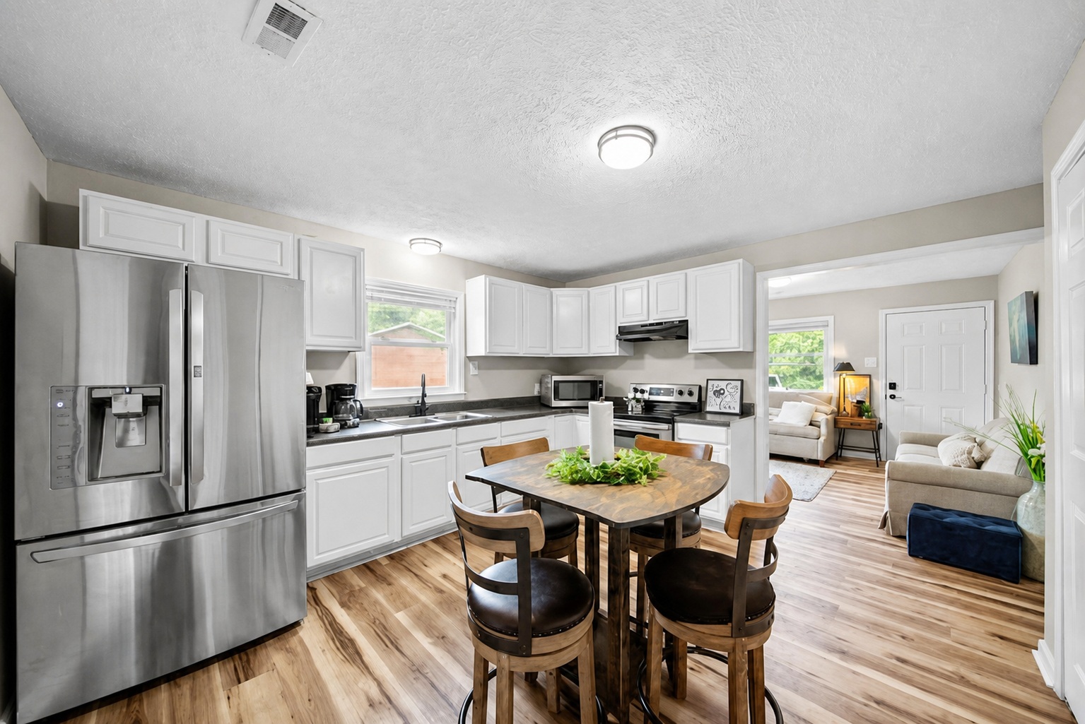 Bright furnished kitchen with dining area and living space